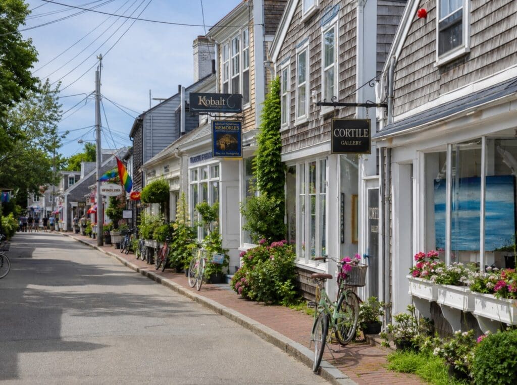 Commercial Street in the East End, showing galleries, bicycles, flowers, and traditional Cape Cod architecture