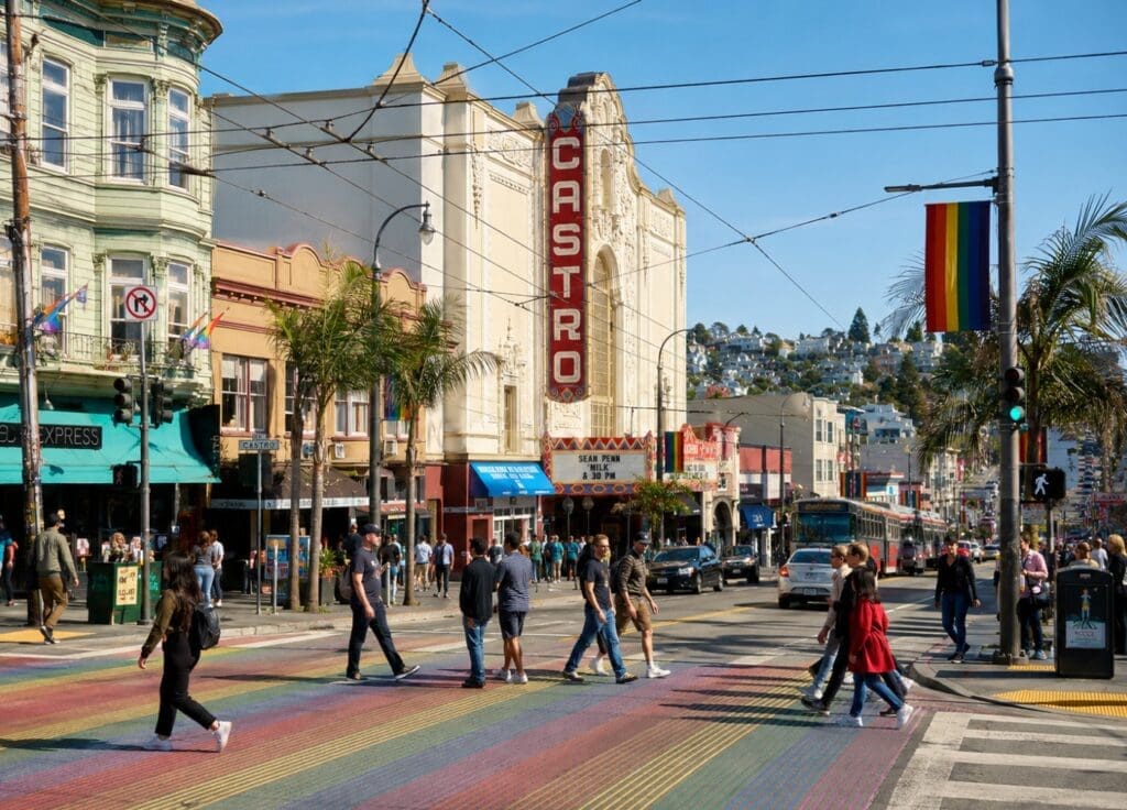 original image of Castro Street showing the rainbow crosswalks, Castro Theatre sign, and neighborhood foot traffic