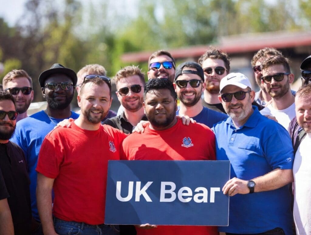photograph of a diverse group of men smiling at a UK Bear community event
